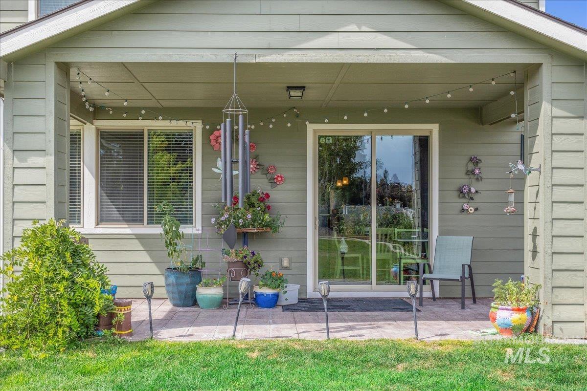 View of exterior entry featuring a patio area