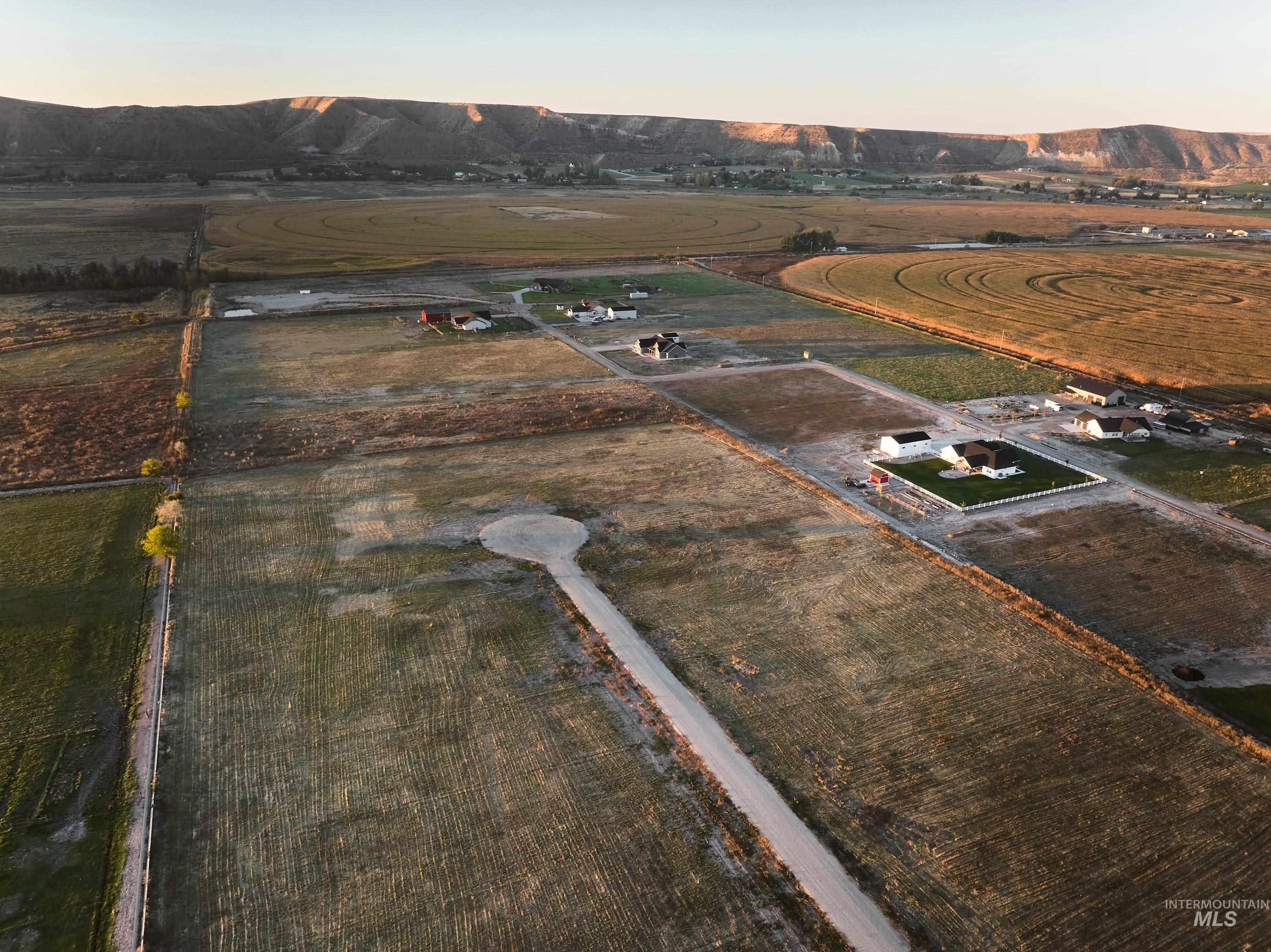 Aerial view at dusk of a mountain view and a view of countryside