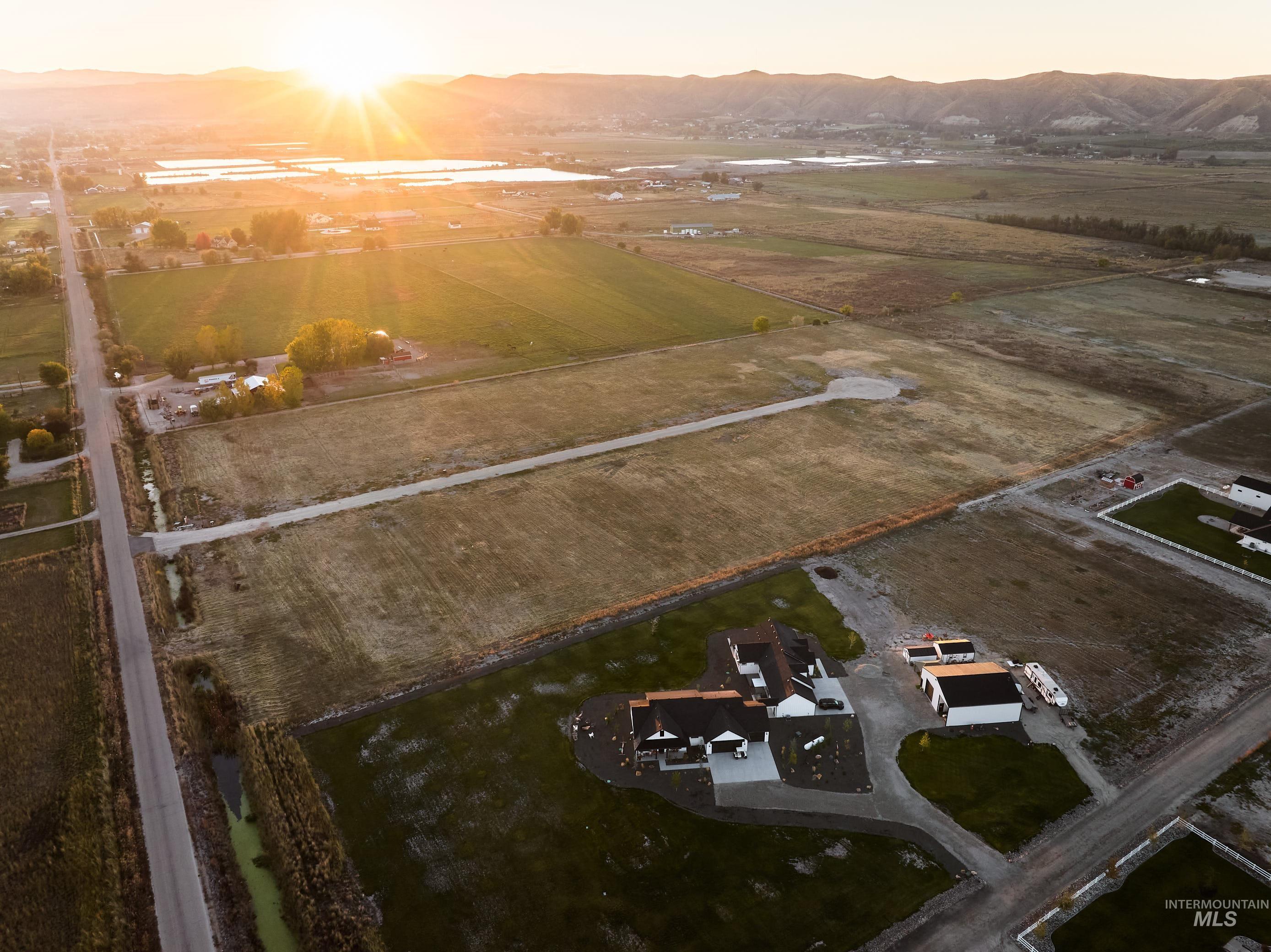 Aerial view at dusk of a view of rural / pastoral area and a mountain view