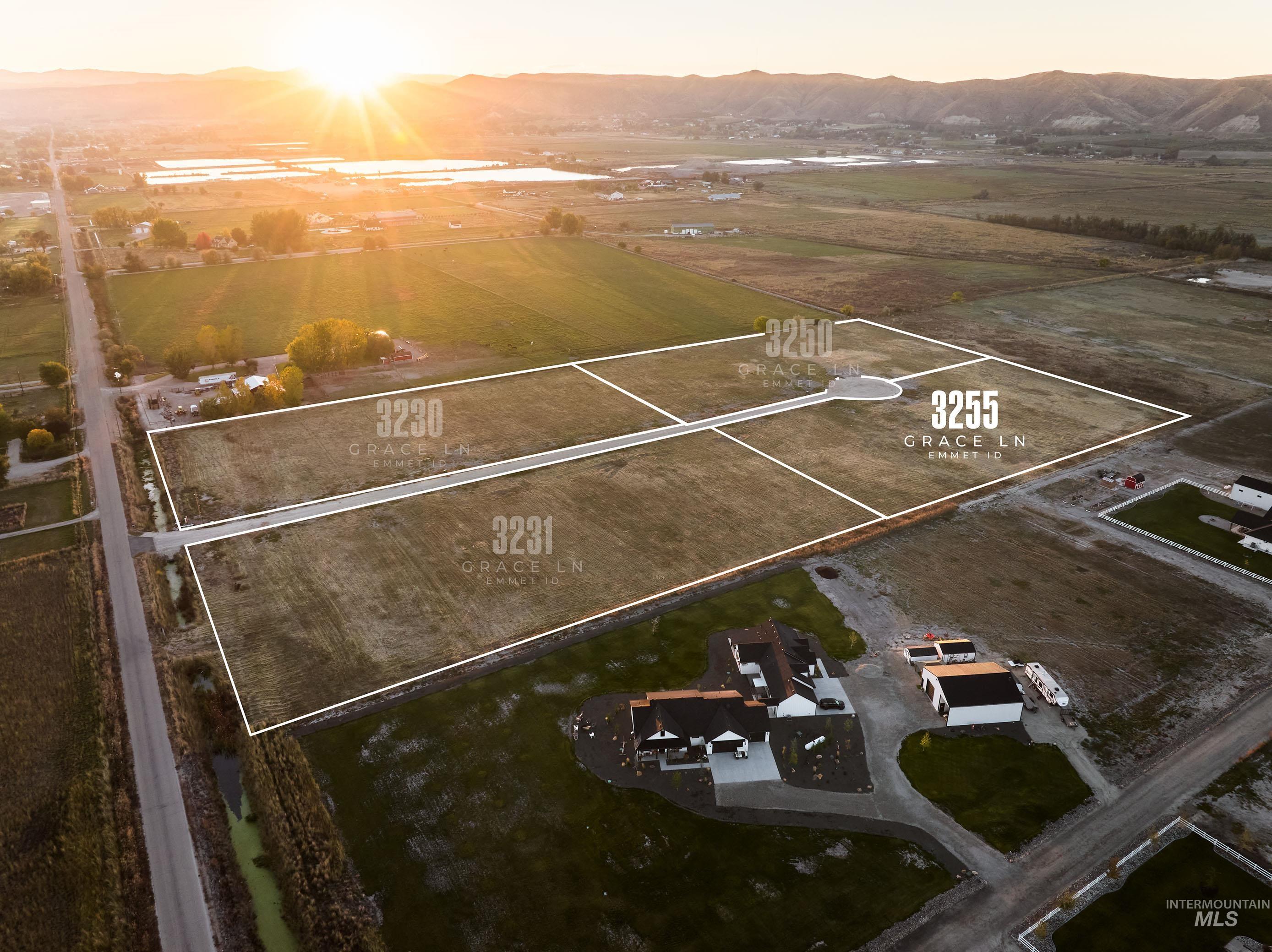 Aerial view at dusk of a mountain view, a view of countryside, and property parcel outlined
