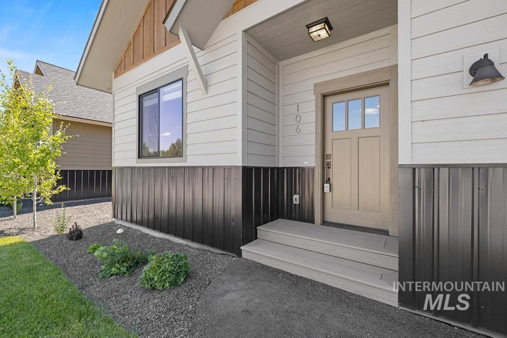 Doorway to property with board and batten siding