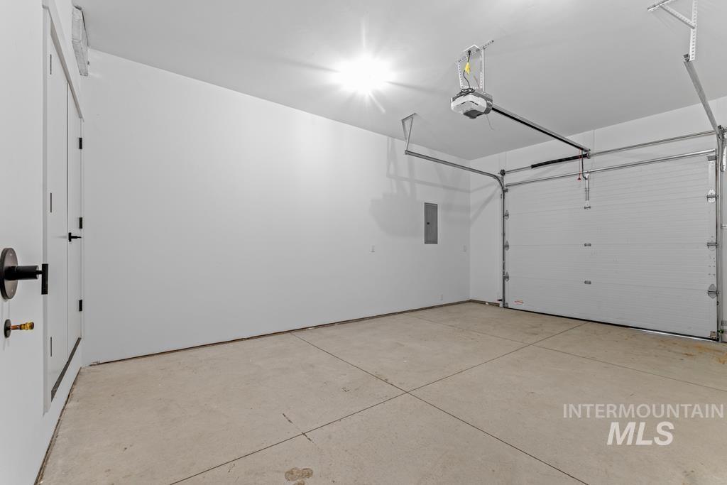 Garage with a garage door opener and electric panel