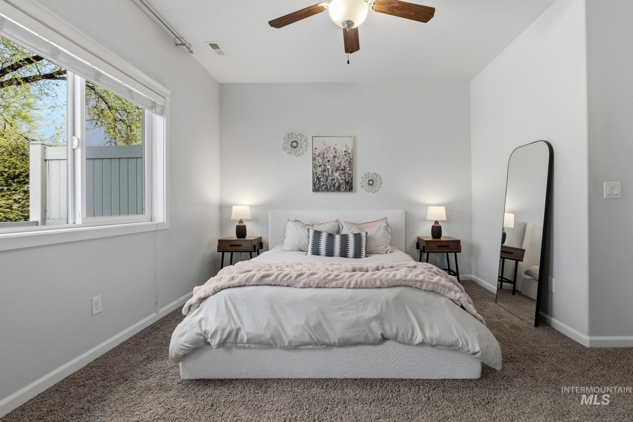 Bedroom featuring carpet flooring and a ceiling fan