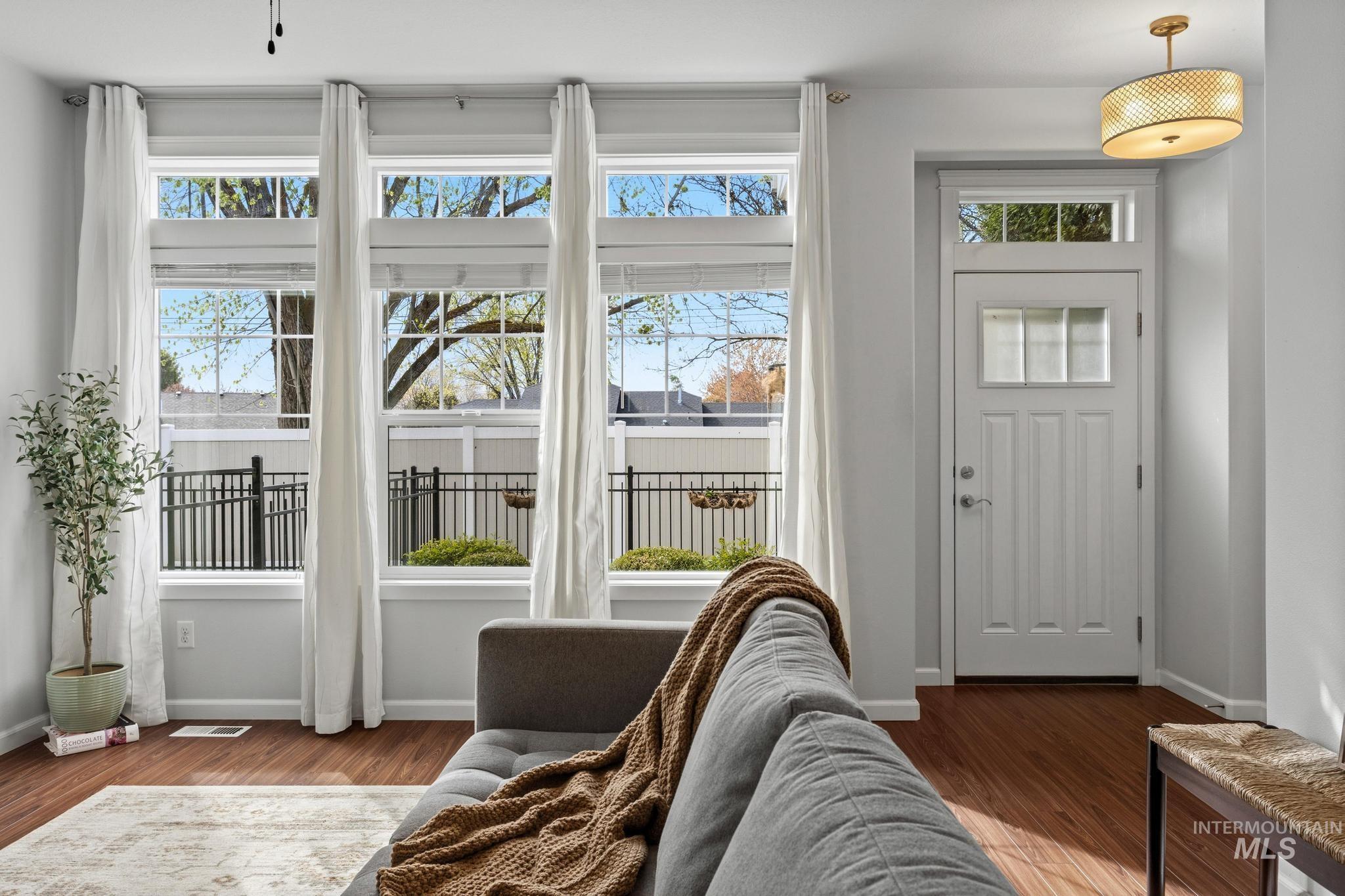 Foyer featuring baseboards and wood finished floors