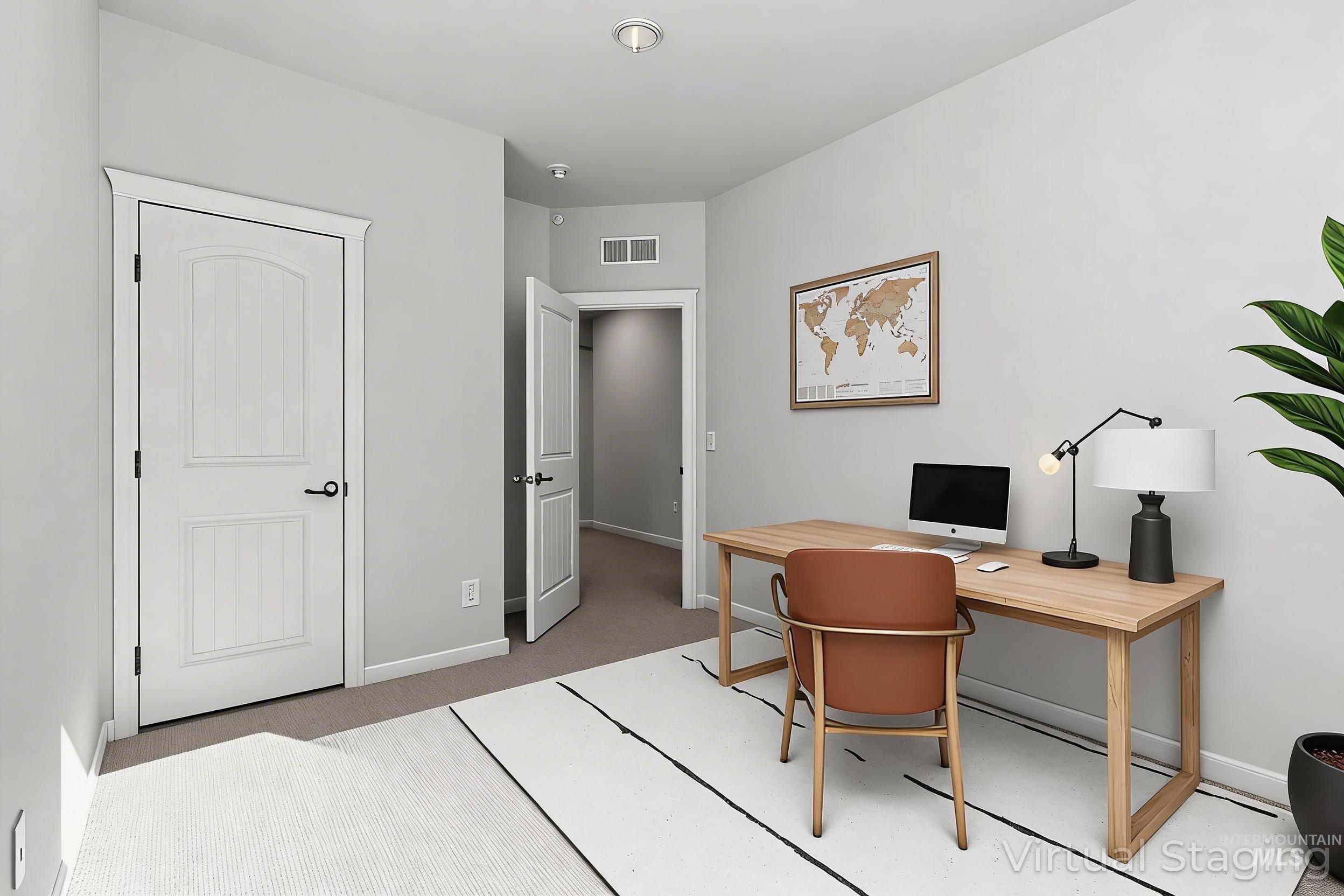 Office with baseboards and light carpet