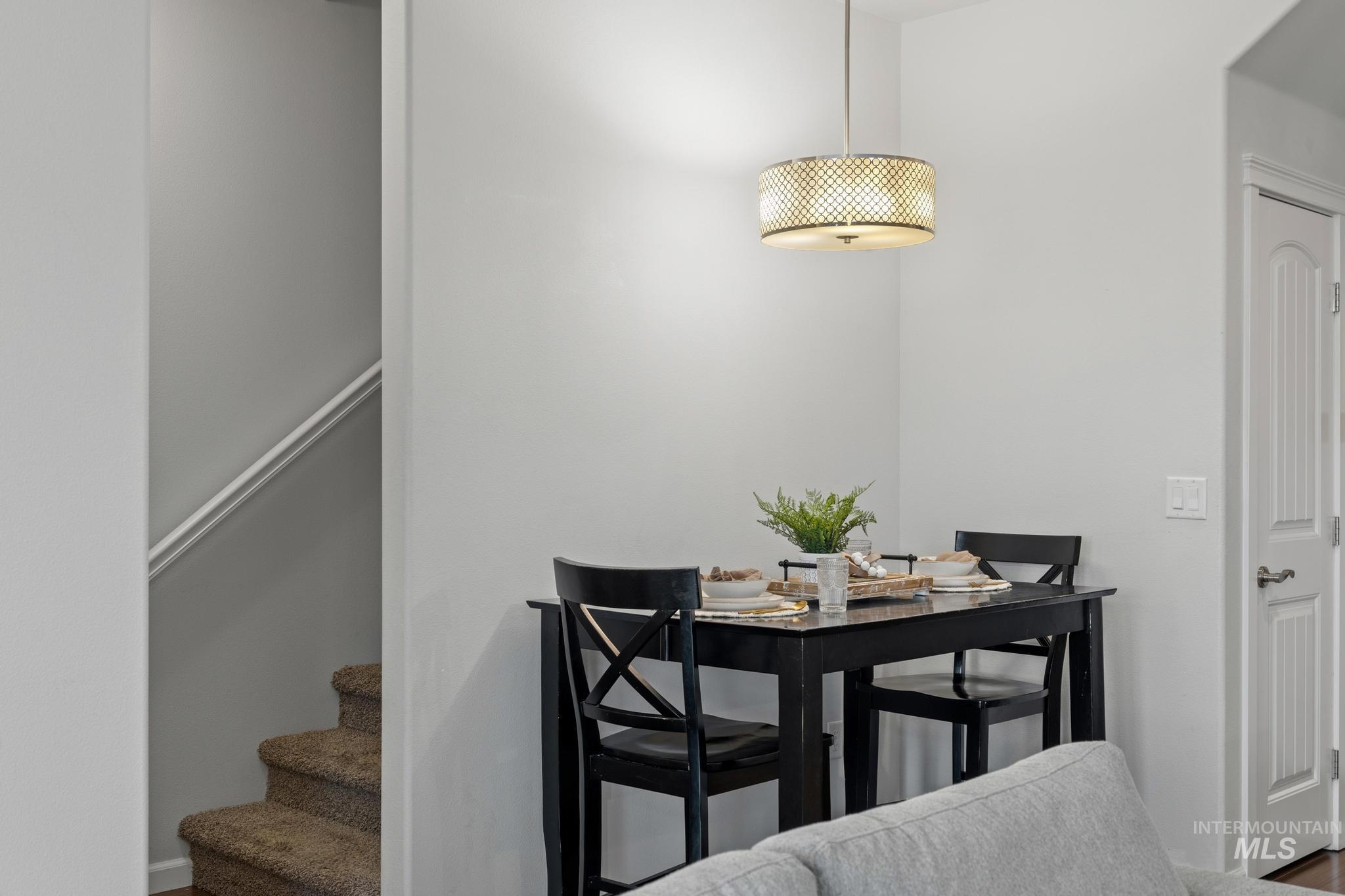 Dining room featuring stairs