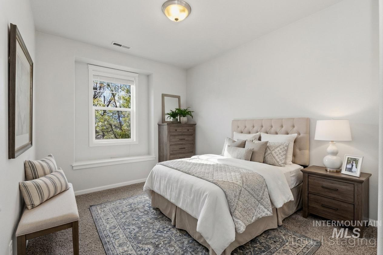 Bedroom with carpet and baseboards