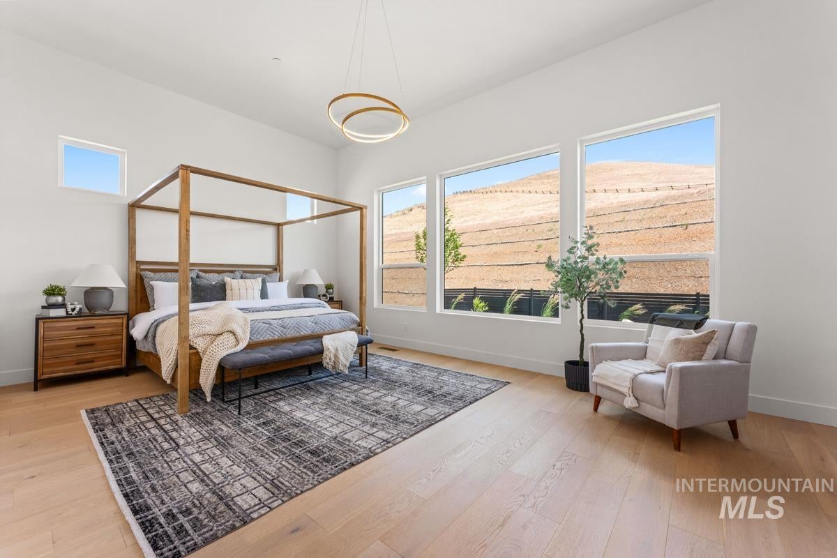 Room featuring light wood-finish flooring and white walls