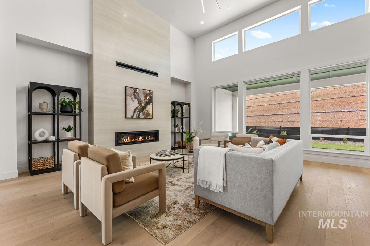 Soaring ceiling height with a contemporary linear fireplace set into a textured accent wall