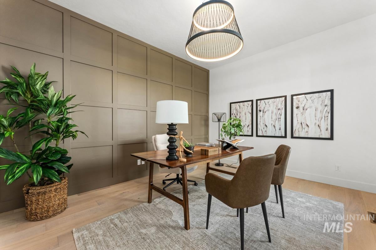 Light wood-finish flooring with a textured area rug