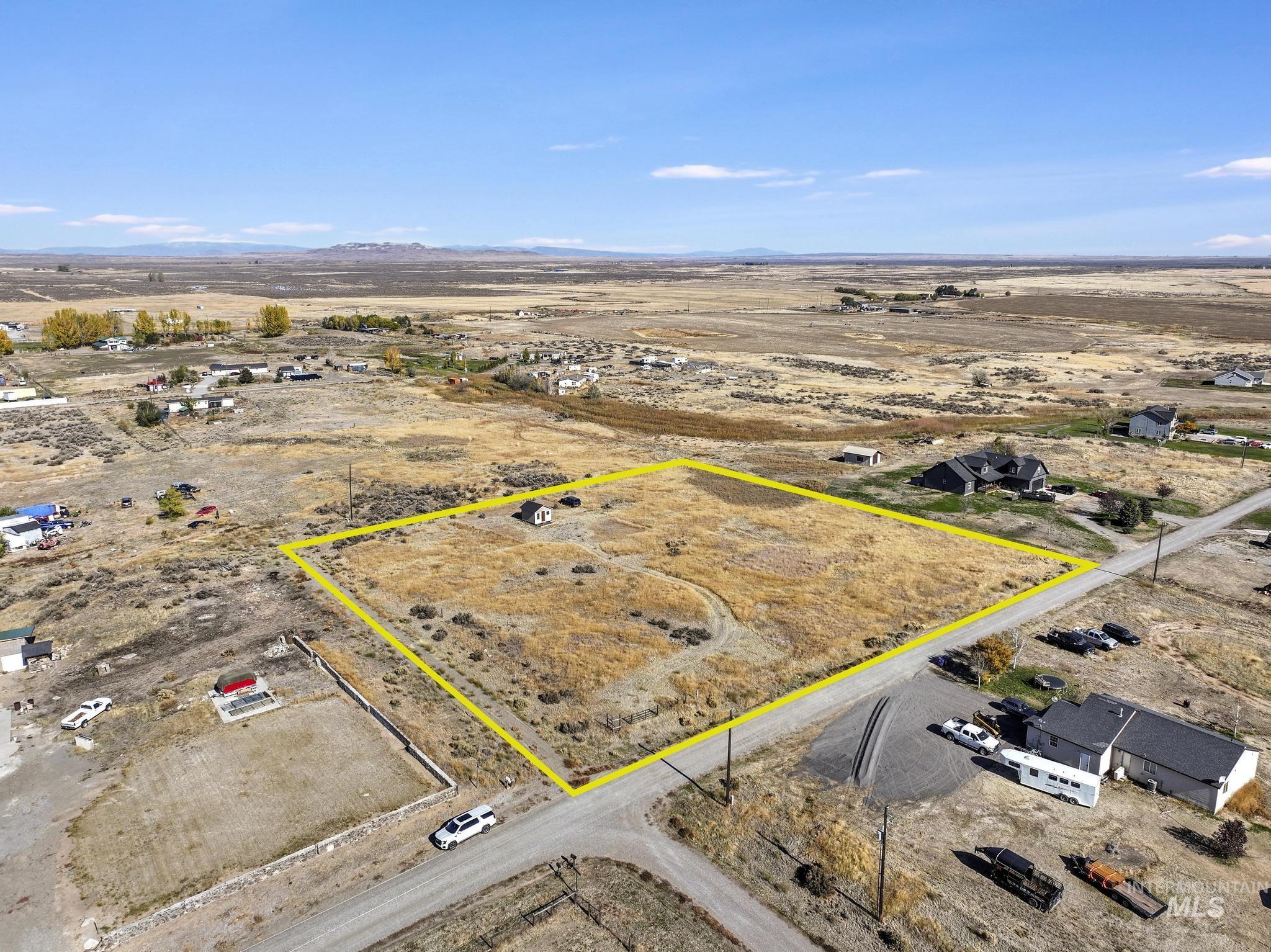 Aerial view of sparsely populated area with a desert landscape and property boundaries highlighted