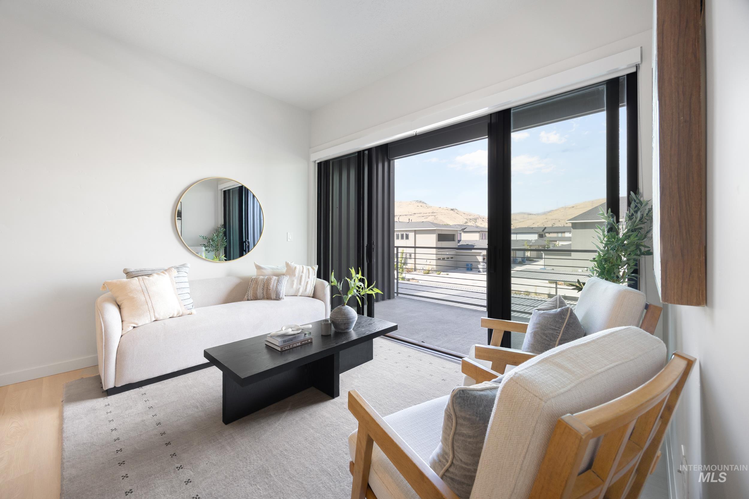 Living room featuring baseboards and wood finished floors