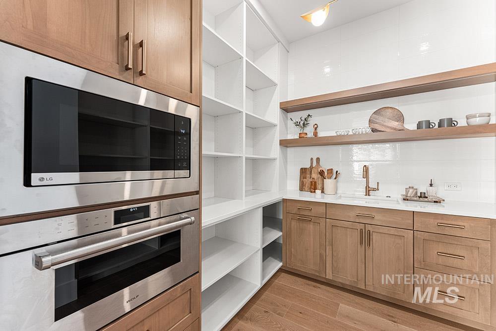 Pantry featuring a sink