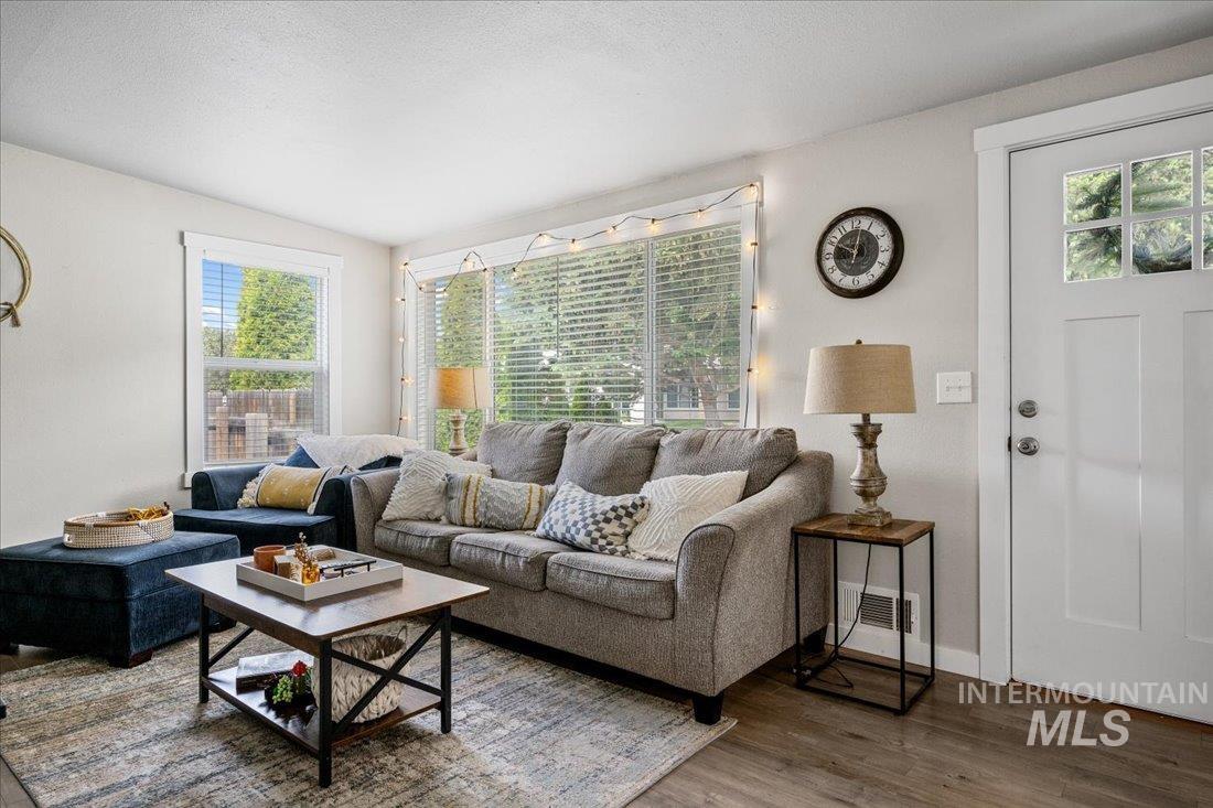 Living area featuring wood finished floors and baseboards