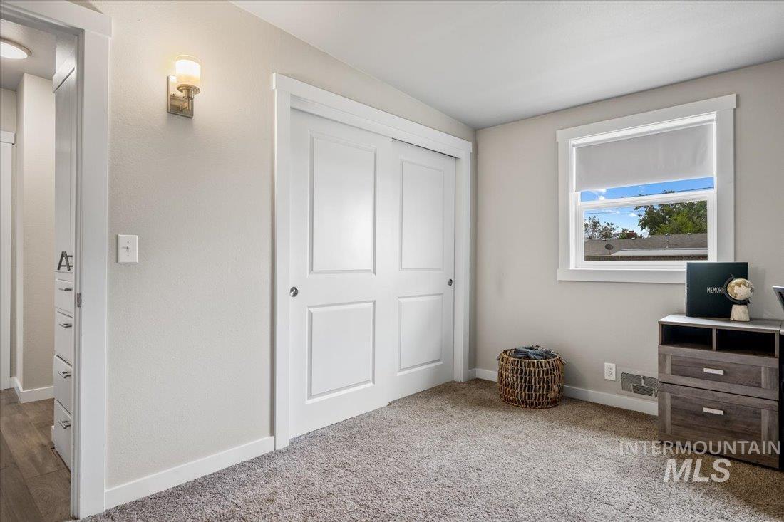 Bedroom featuring a closet and carpet