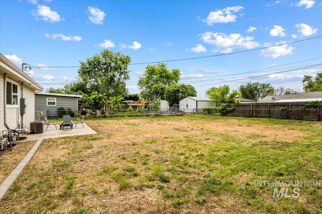 Fenced backyard featuring a patio area