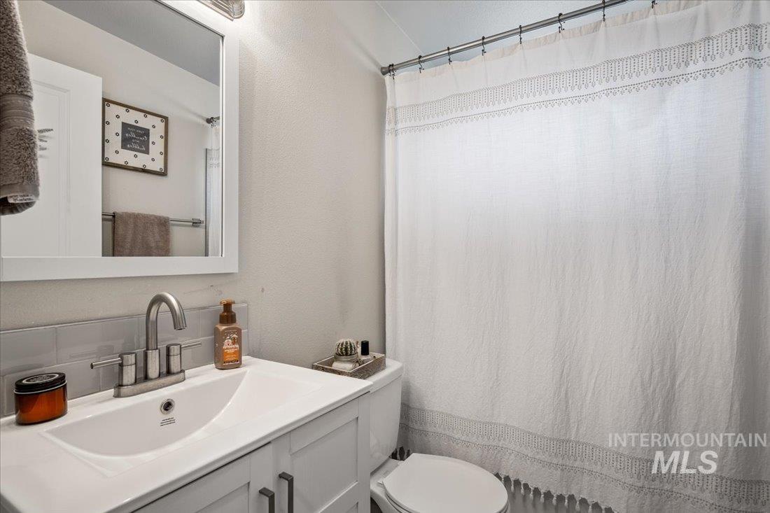 Bathroom with vanity and a shower with curtain