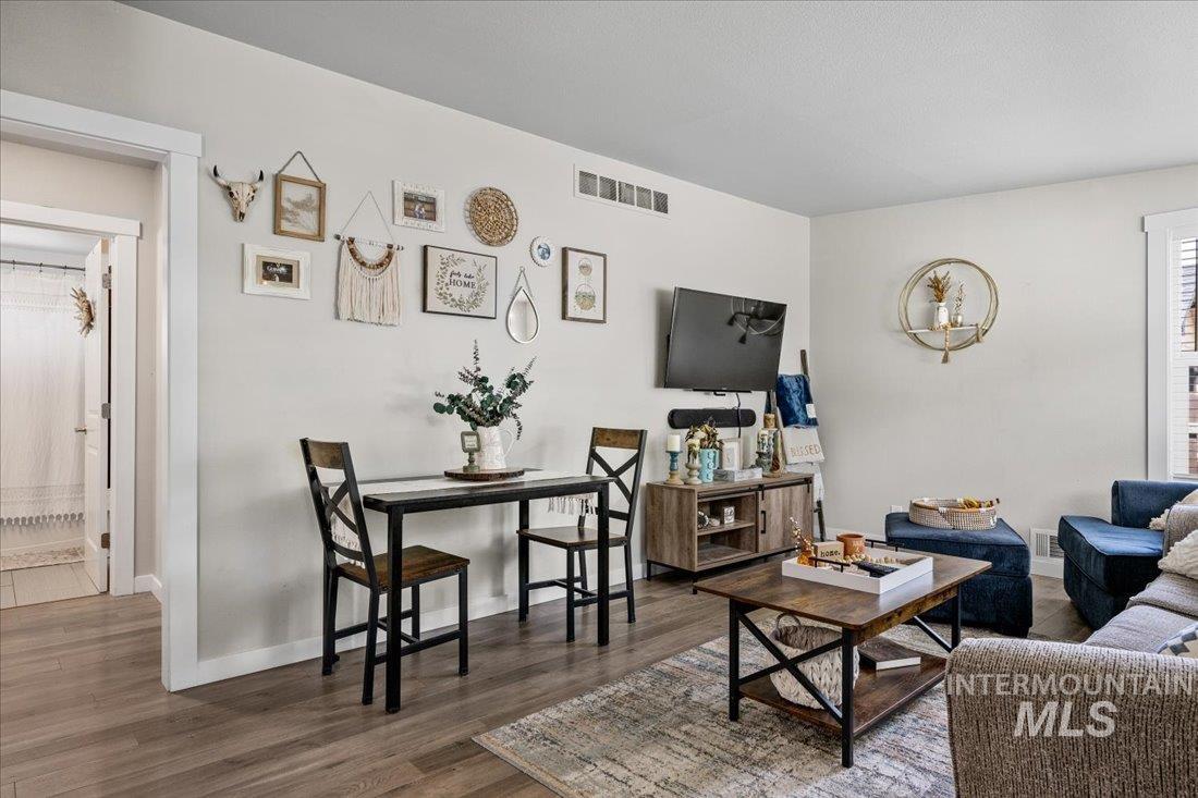 Living area featuring wood finished floors and baseboards