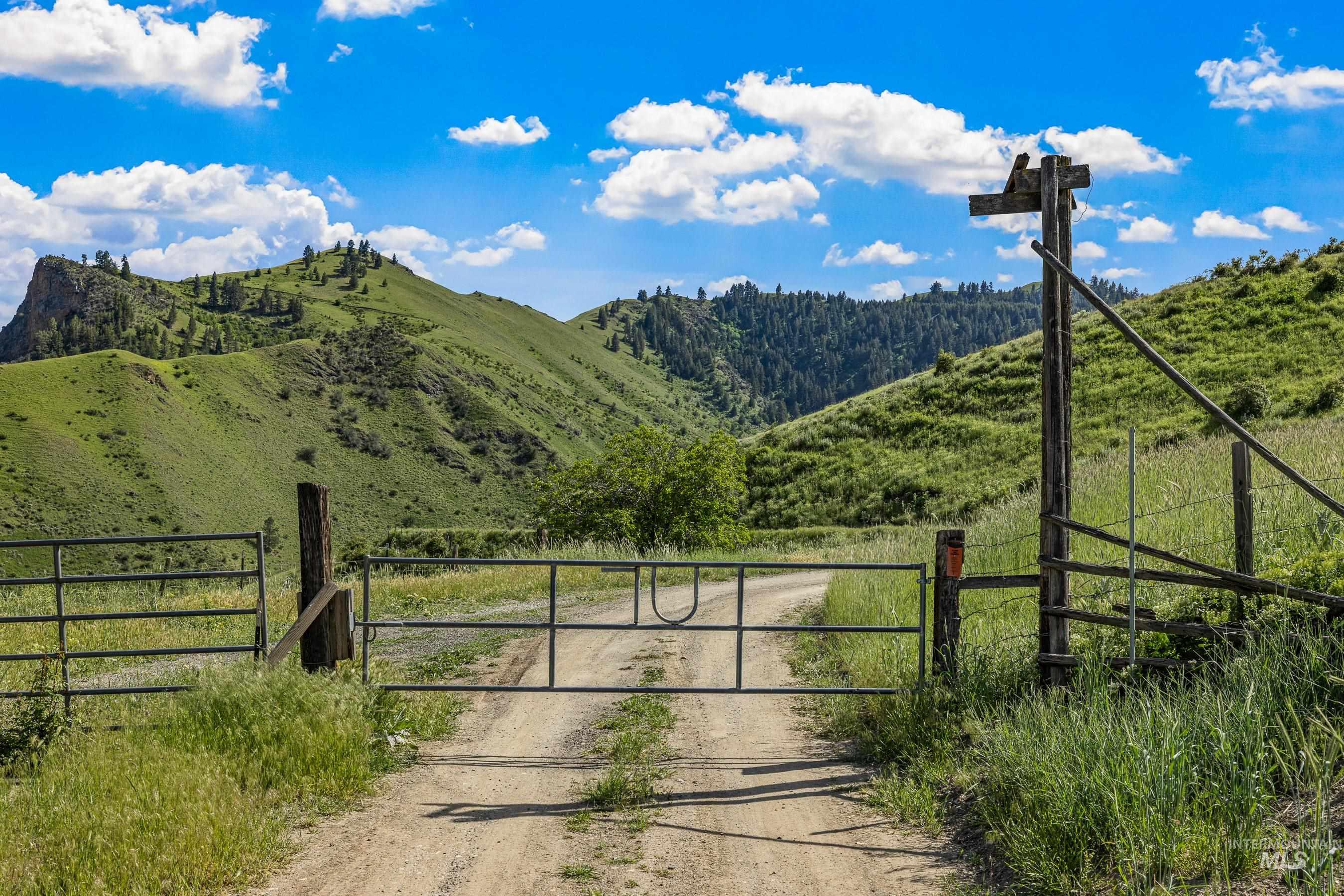Gate on Seven U Ranch Road leading into the property