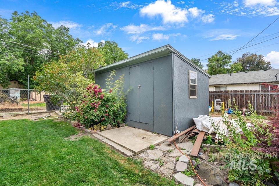 View of outbuilding with a fenced backyard