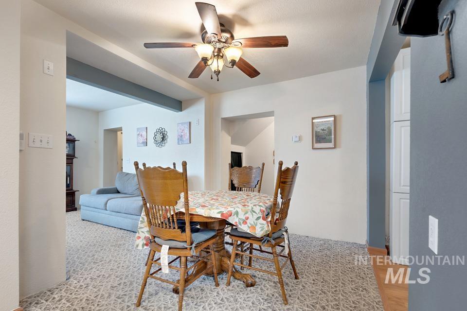 Dining space with ceiling fan
