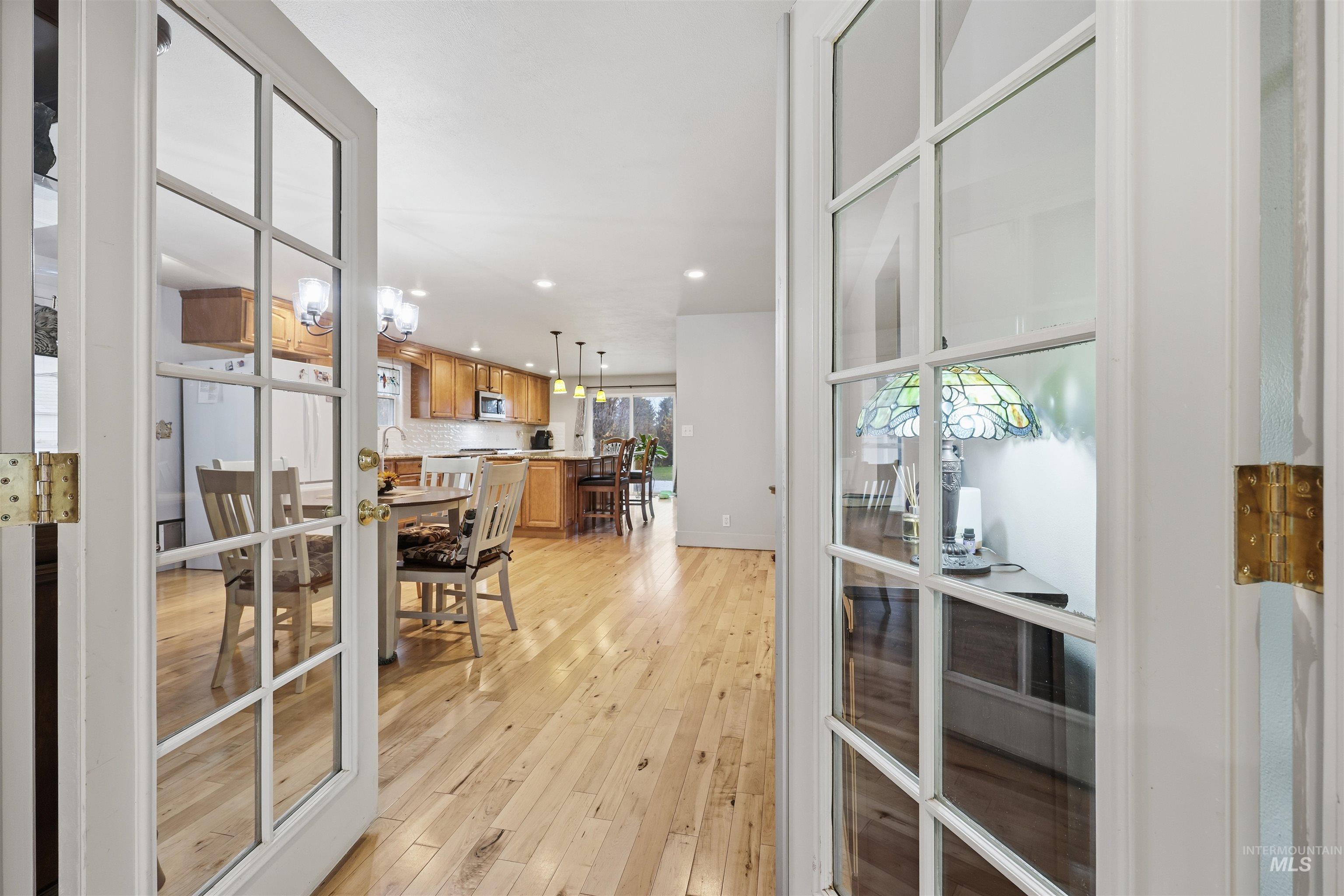Doorway featuring recessed lighting and hardwood / wood-style flooring