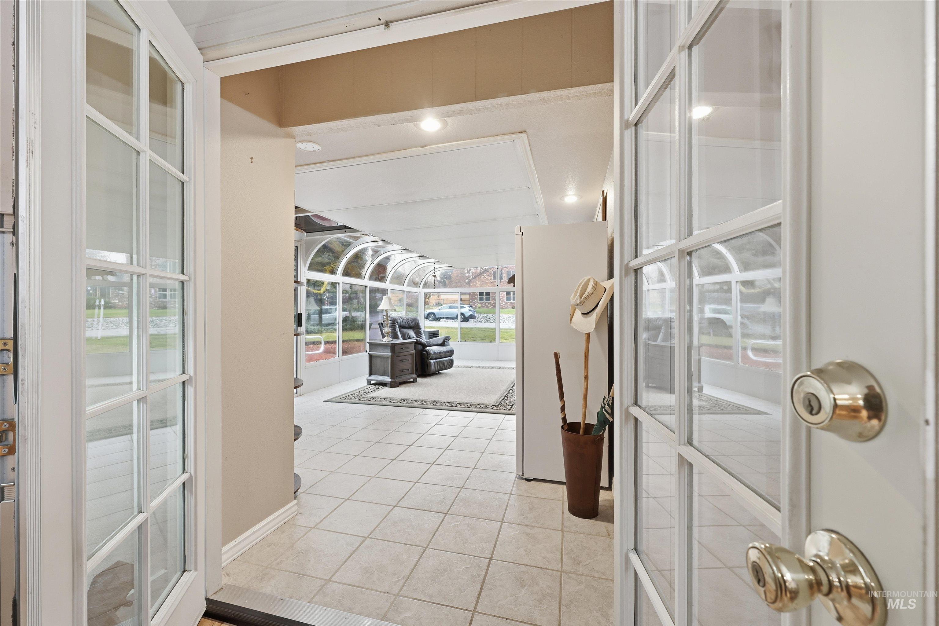 French Doors open to Sunroom