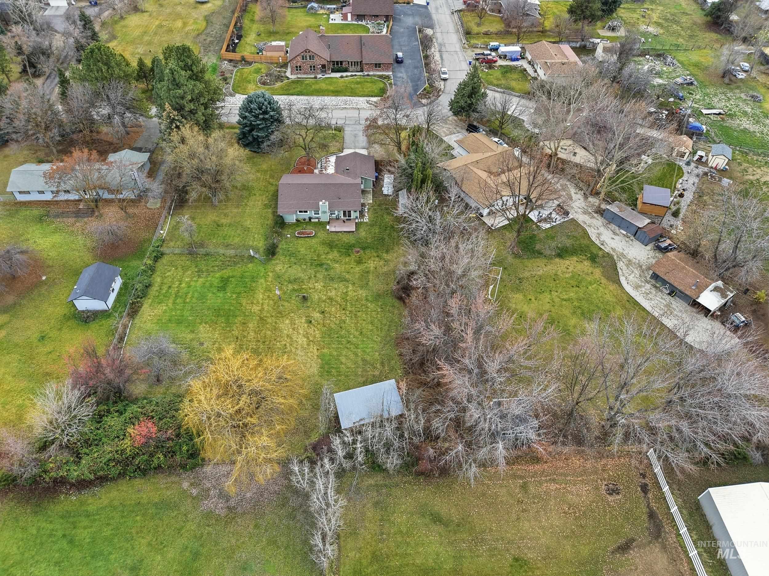 Aerial overview of property's location featuring nearby suburban area