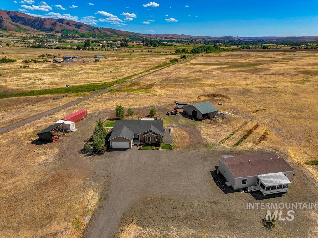 Overview of rural landscape featuring a mountain backdrop