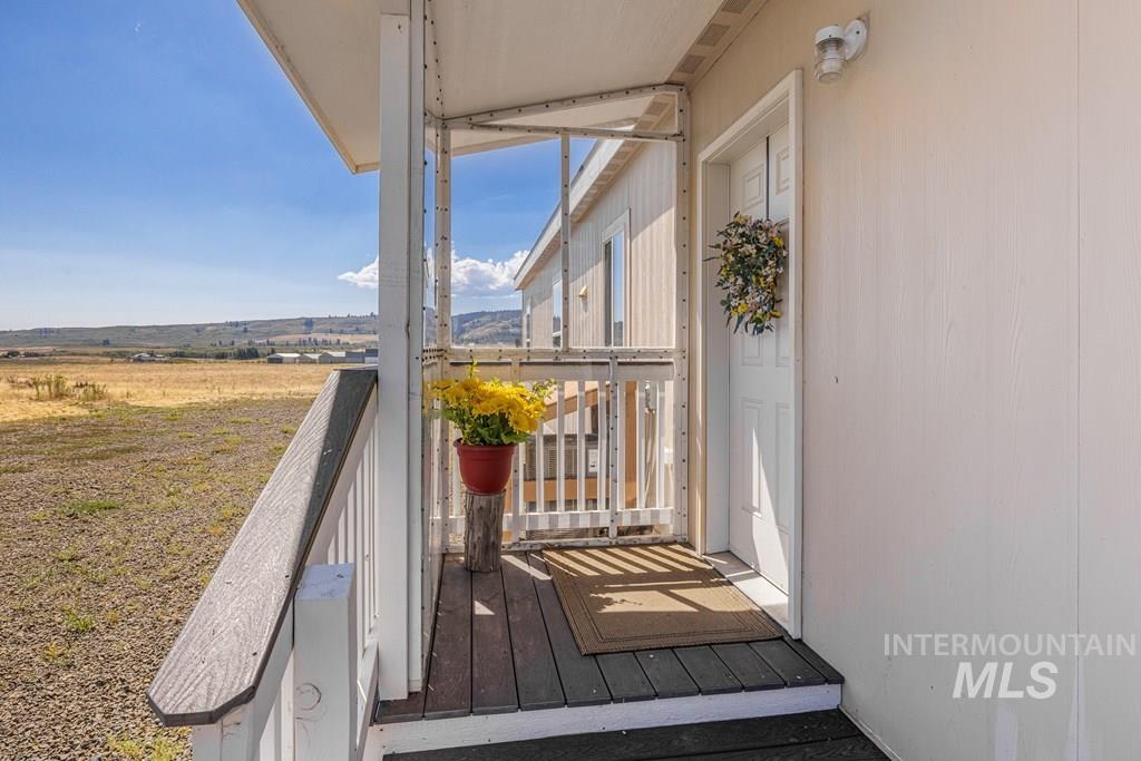 Balcony featuring a sunroom