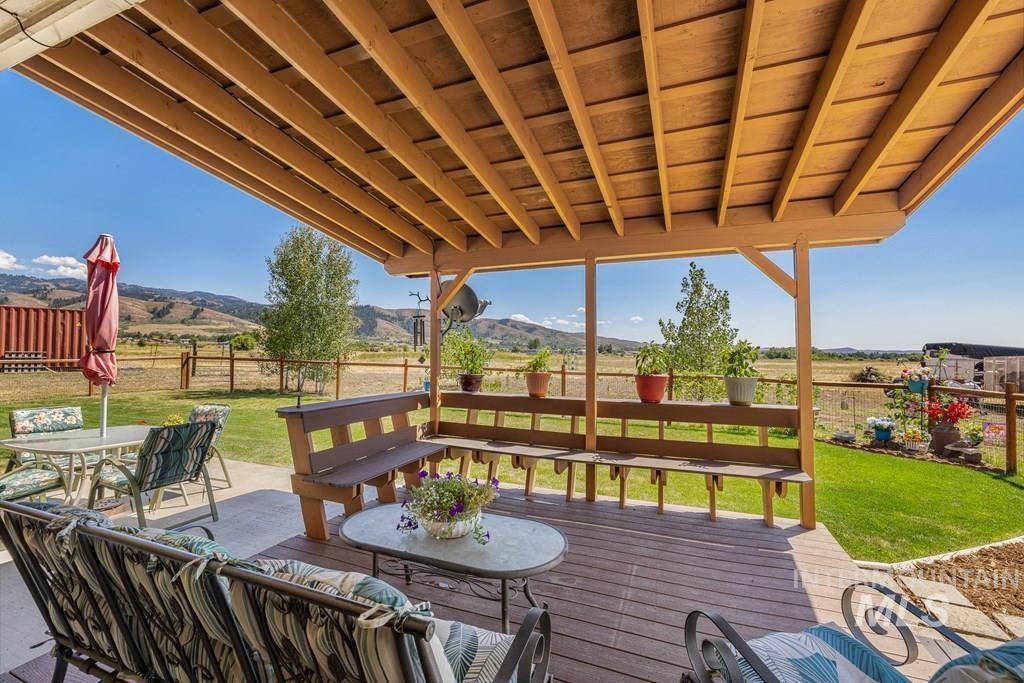 Deck featuring a view of rural / pastoral area and a mountain view