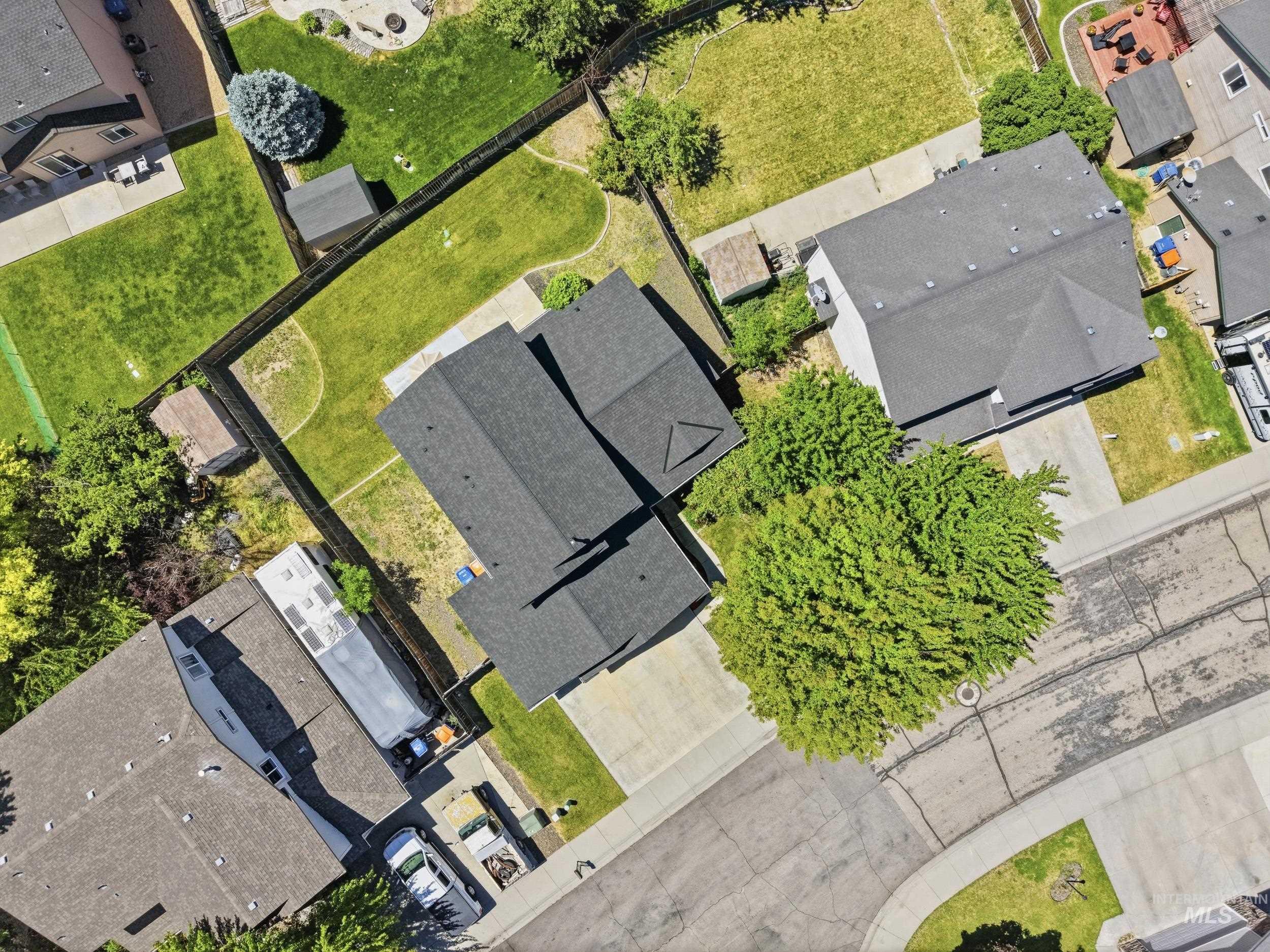 Single-family home with a dark shingle roof and an attached garage