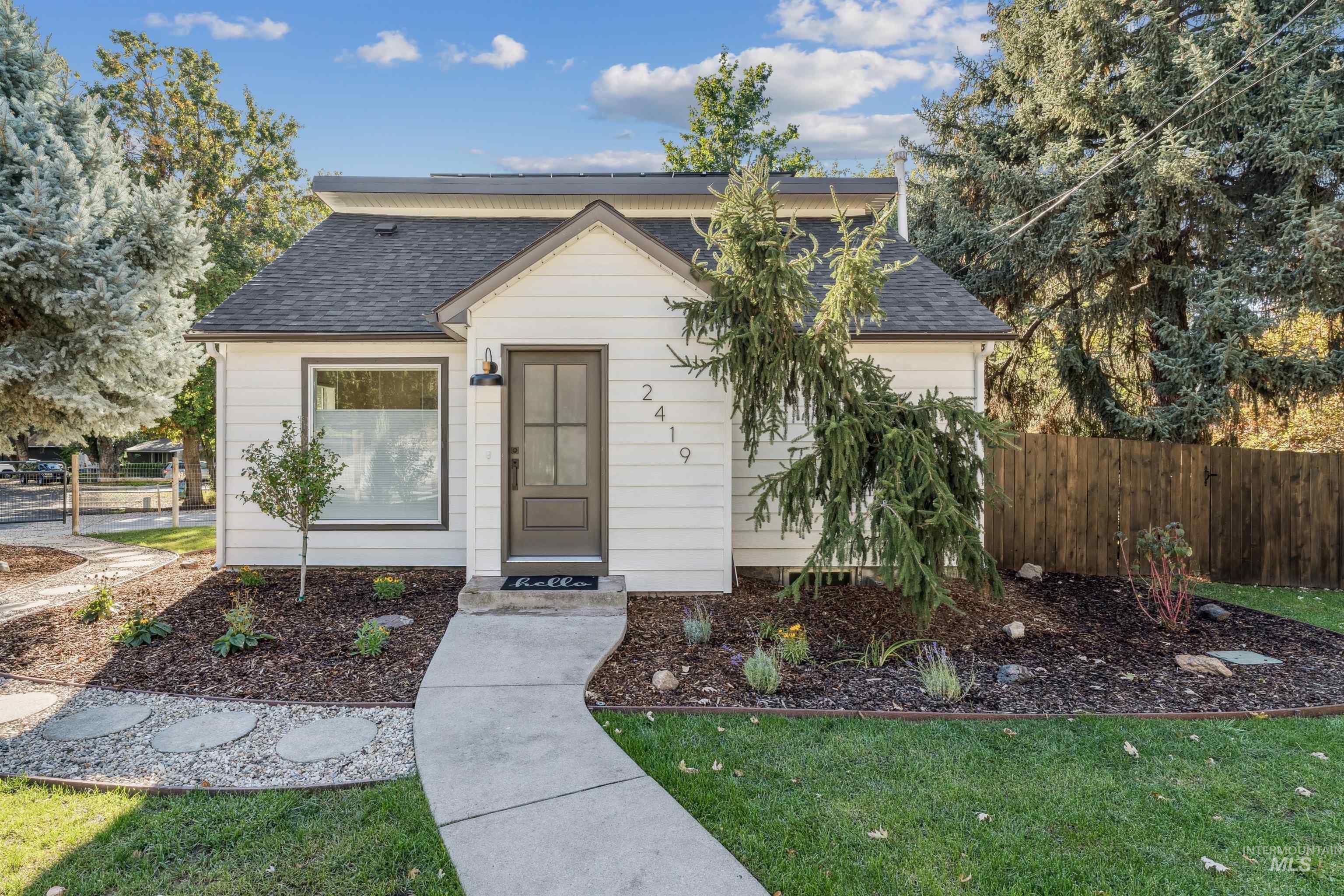 View of front of property featuring roof with shingles