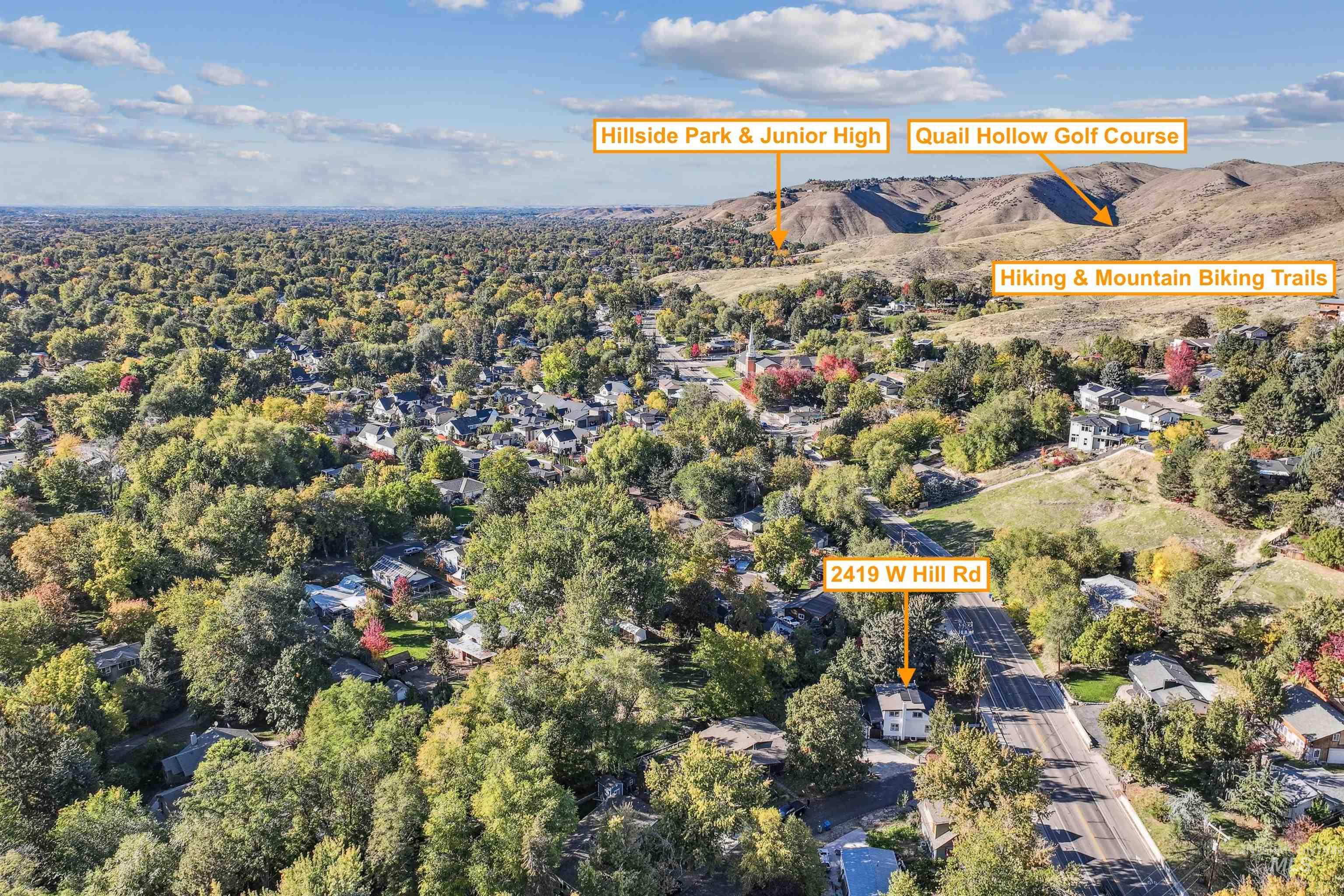 Aerial view of property's location with a mountain backdrop