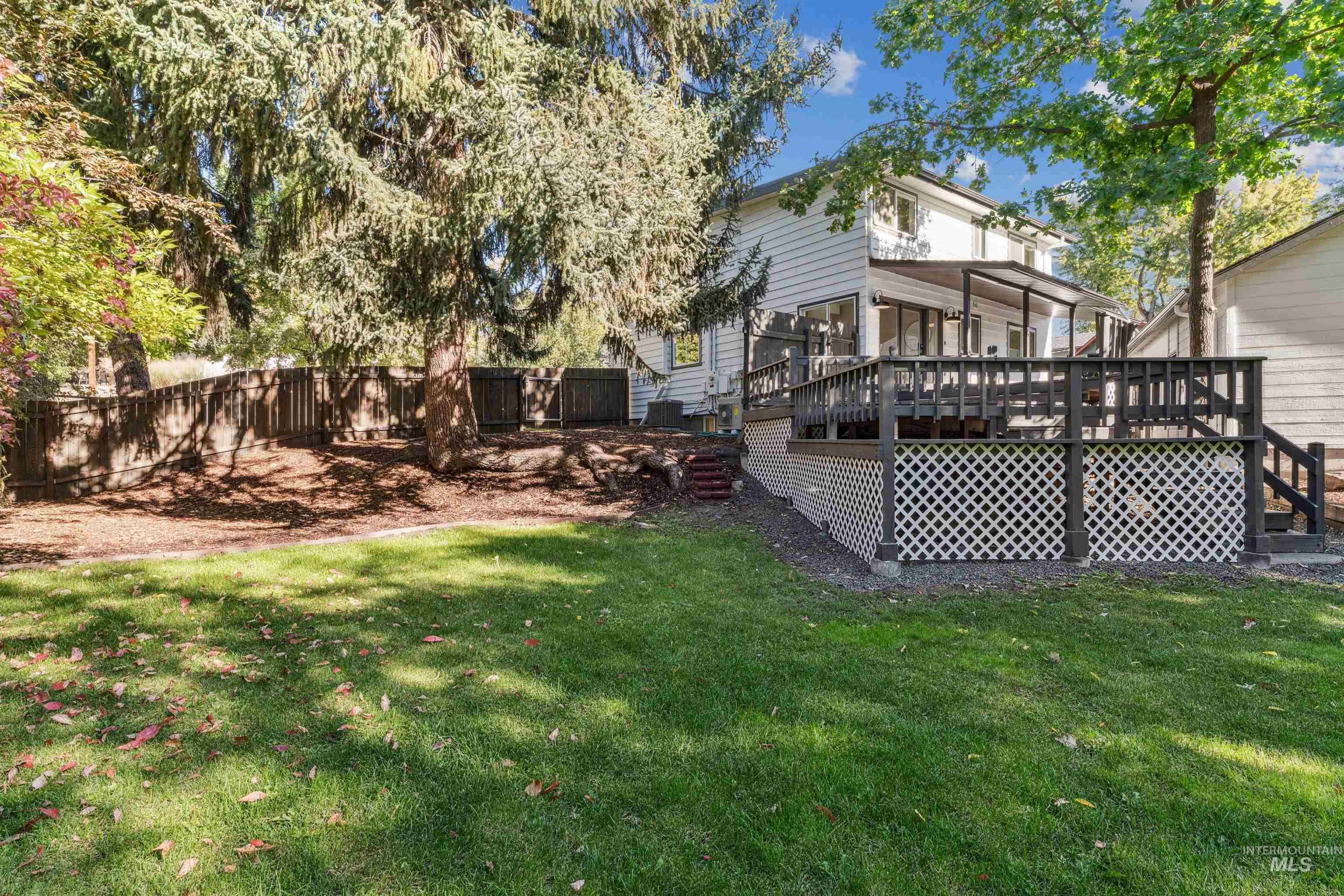 View of backyard with a deck and stairway