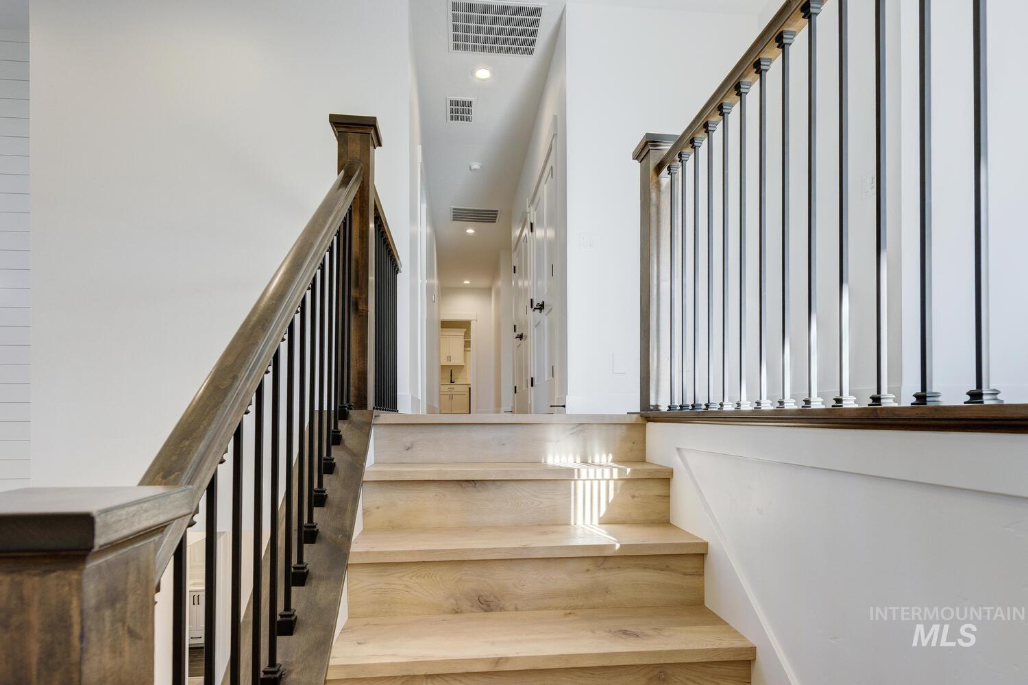 Stairway featuring recessed lighting