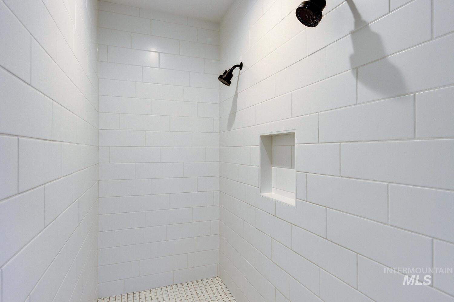 Bathroom featuring tiled shower