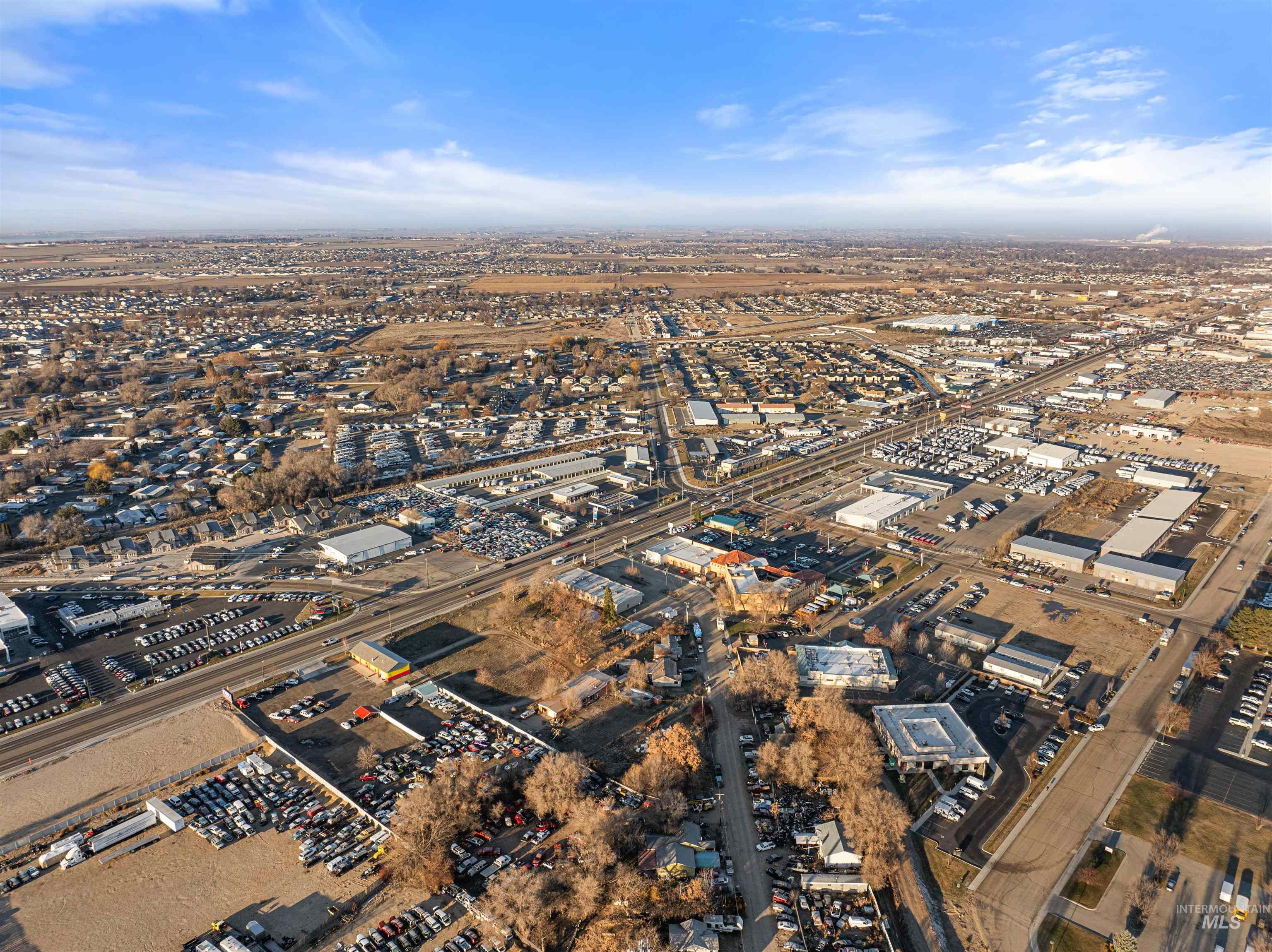 Aerial overview of property's location featuring industrial structures
