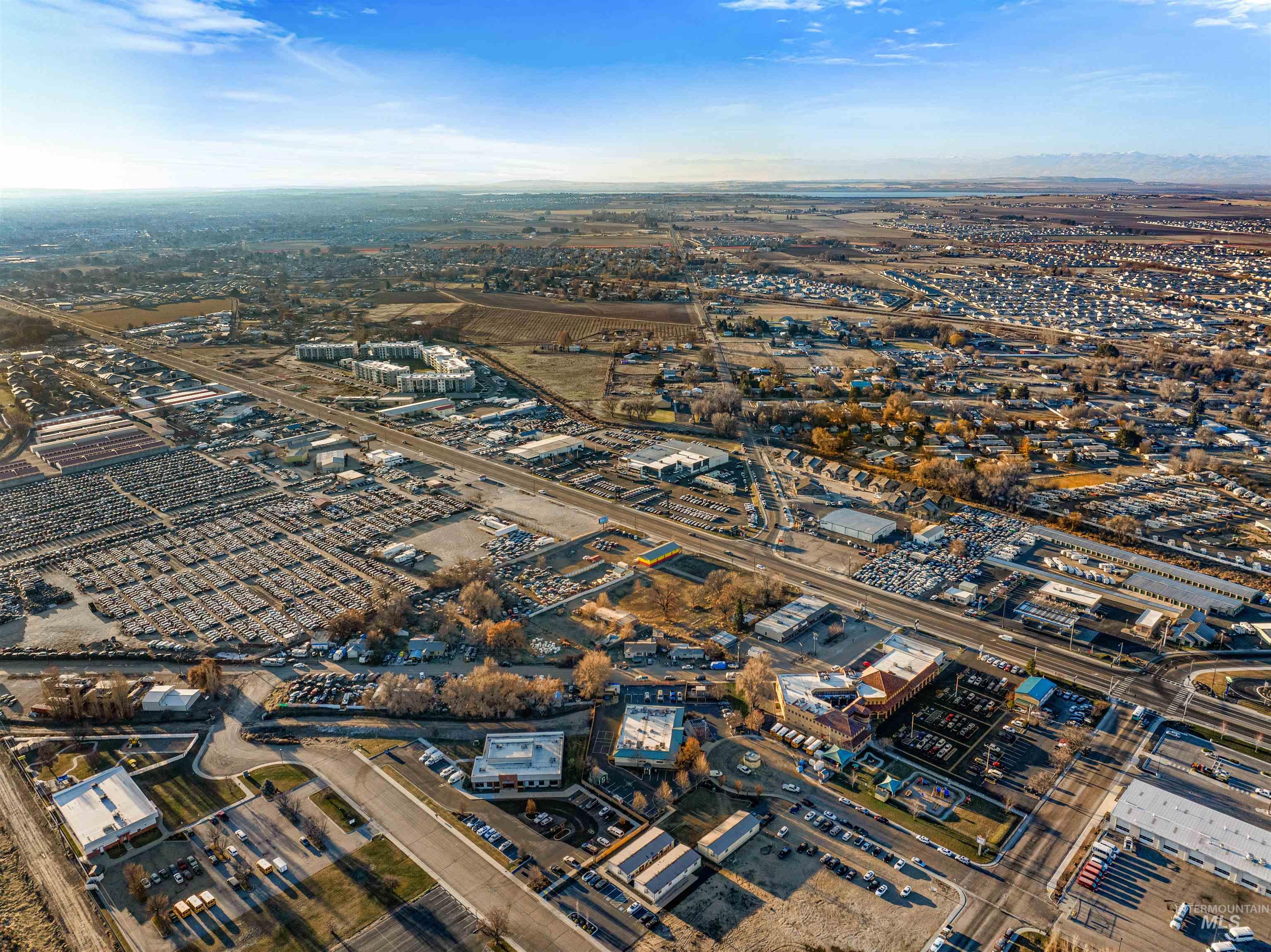 Aerial view of property's location with an industrial area