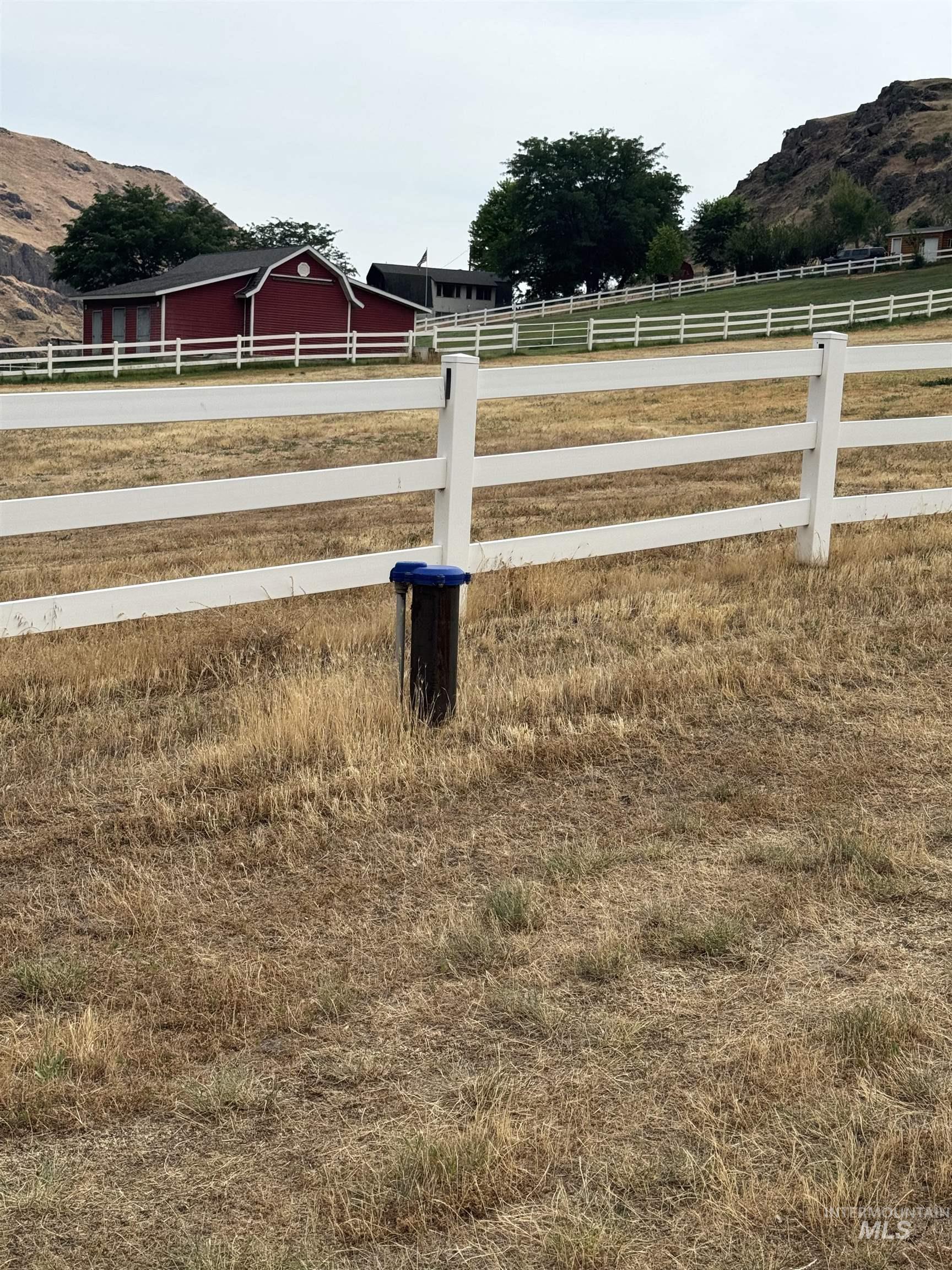View of yard with a mountain view and a view of rural / pastoral area