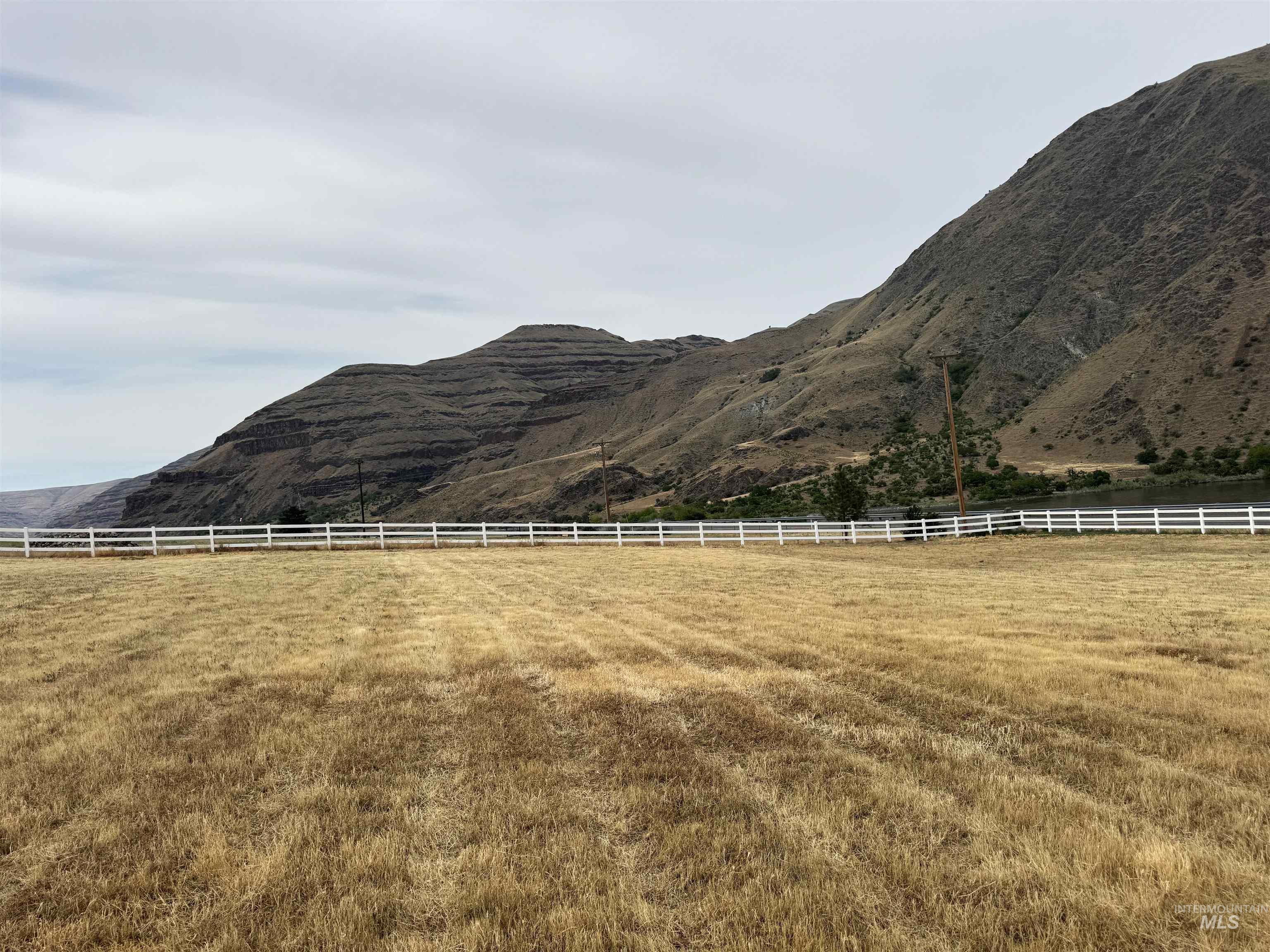 View of yard with a mountain view and a rural view