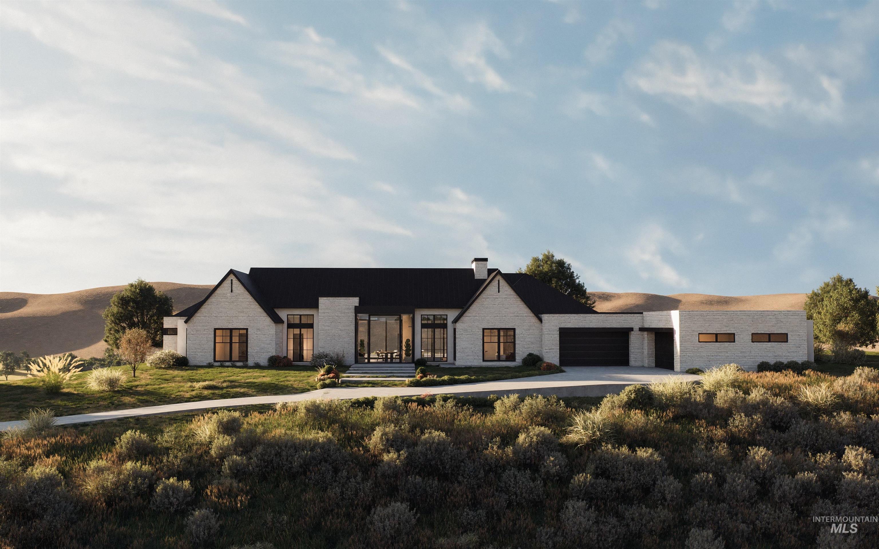 View of front of house featuring stone siding, driveway, a chimney, a patio area, and a garage