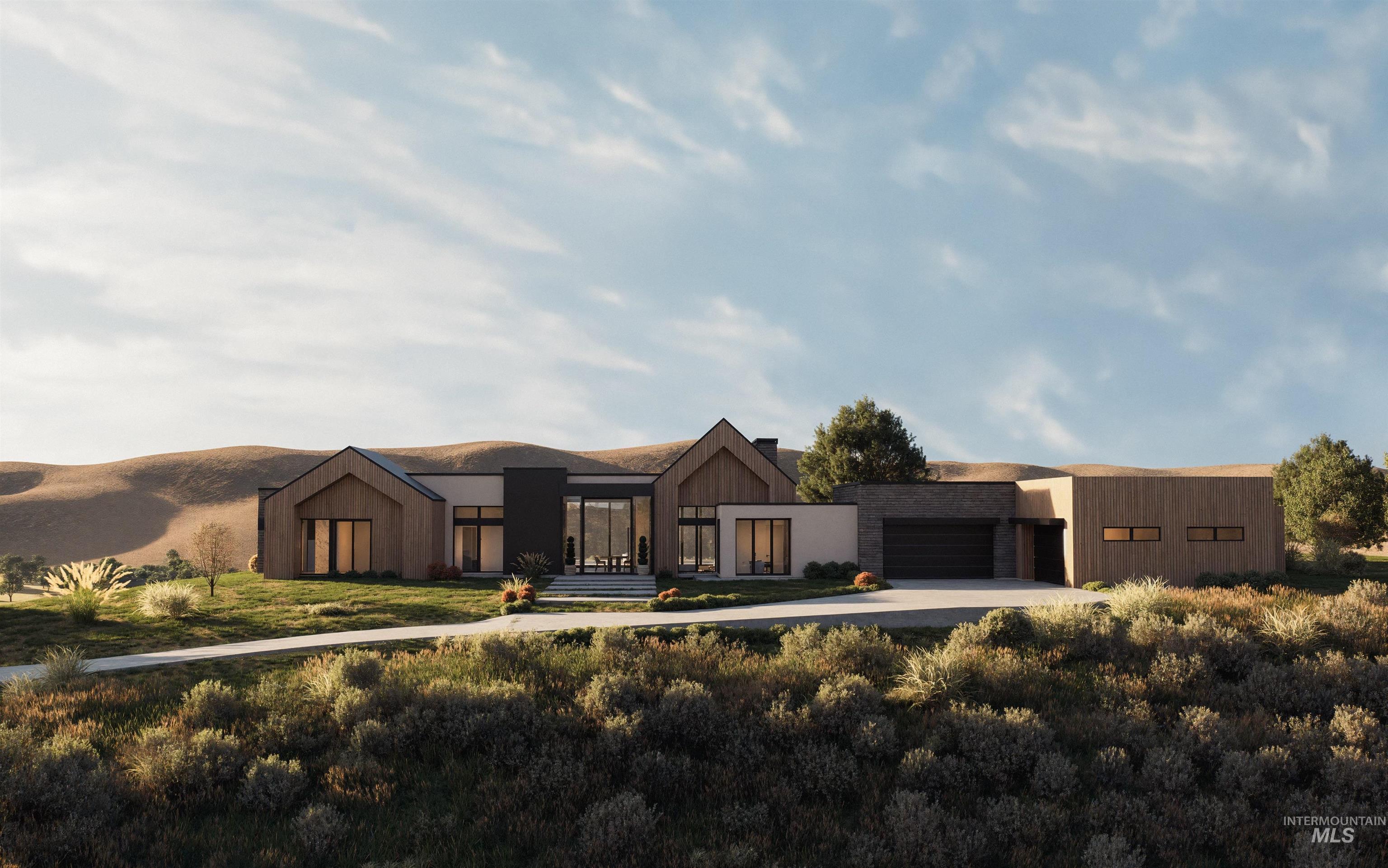 Contemporary house with concrete driveway and an attached garage