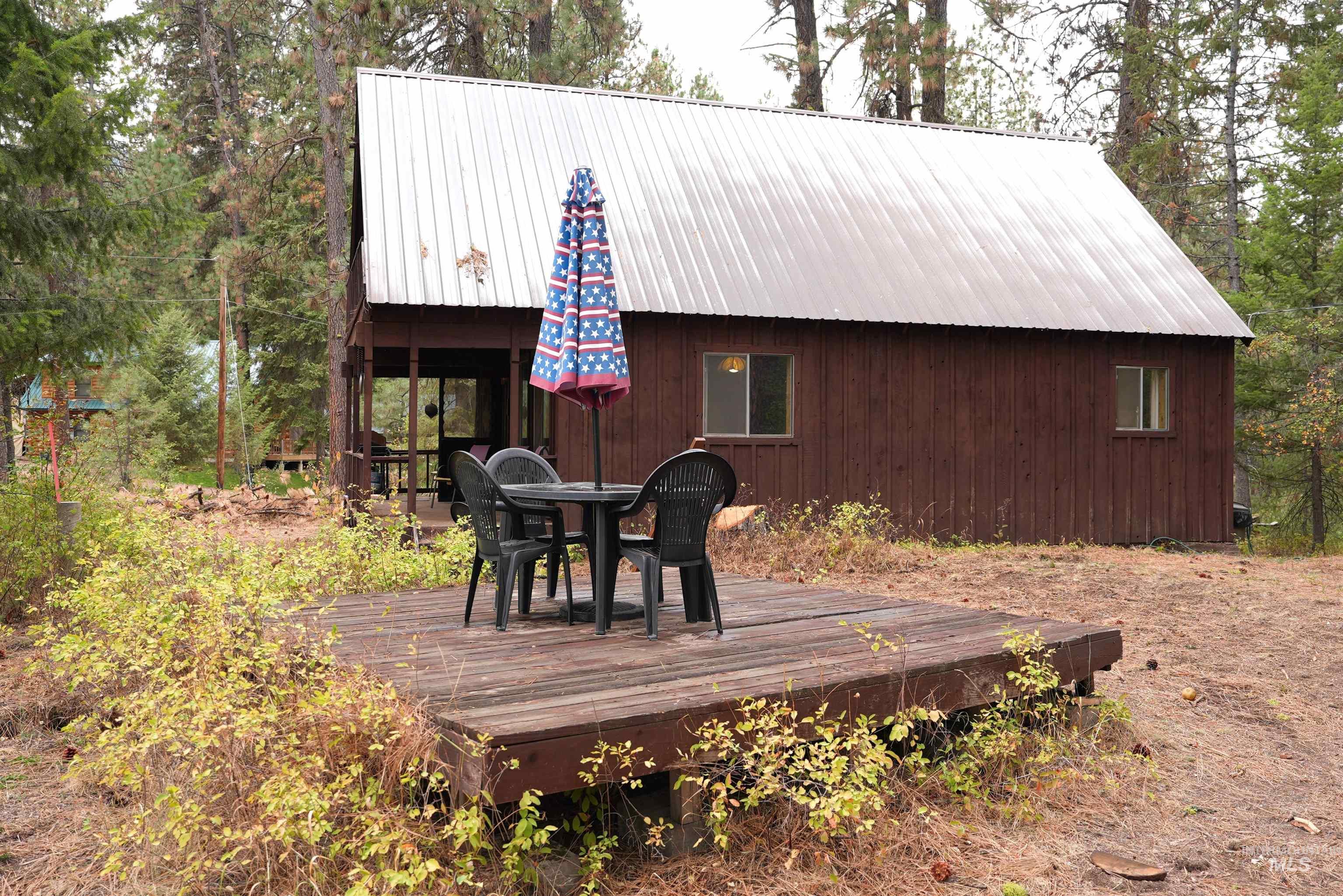 Wooden terrace featuring outdoor dining space
