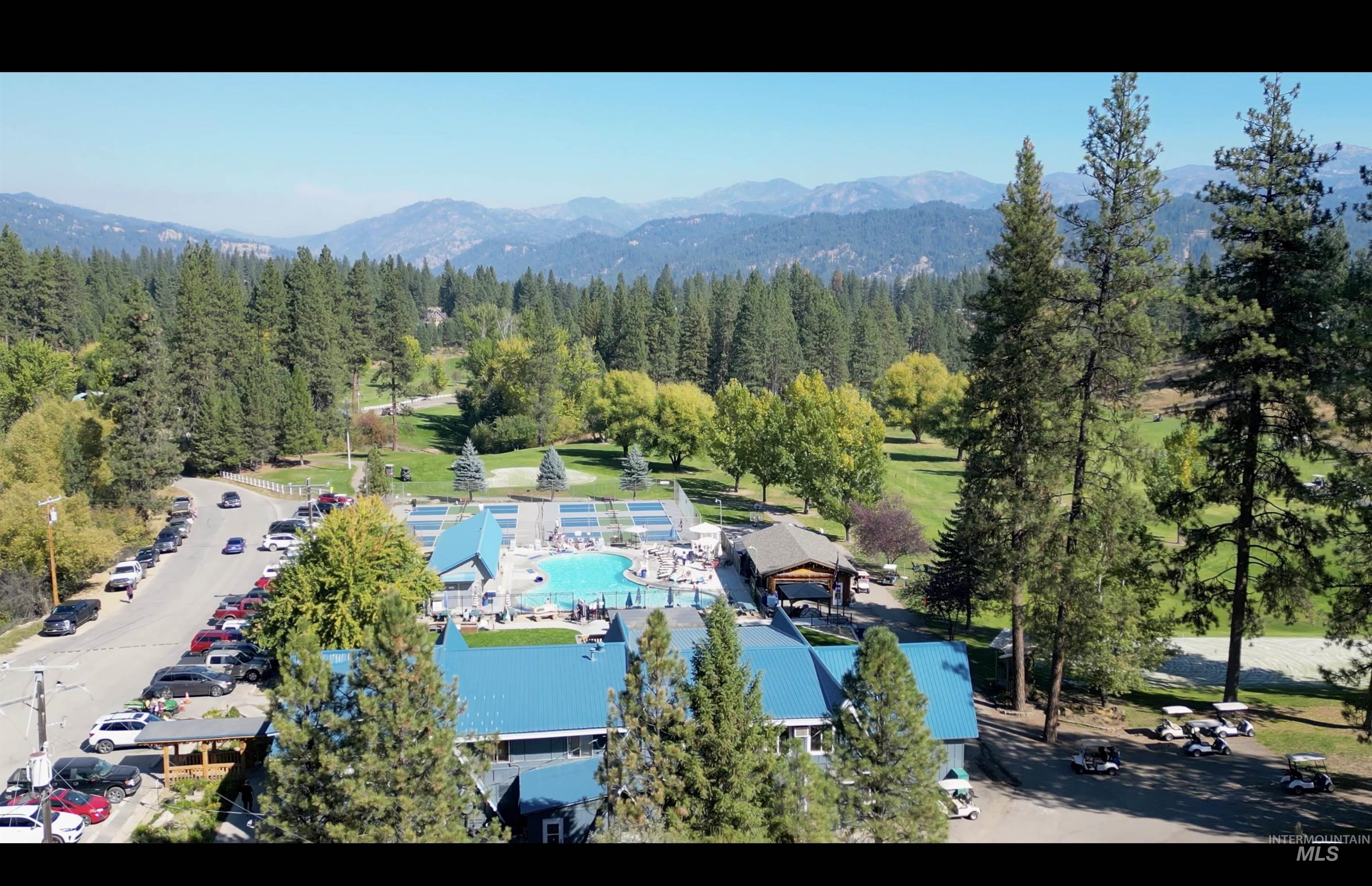 Drone / aerial view of a pool and a mountainous background