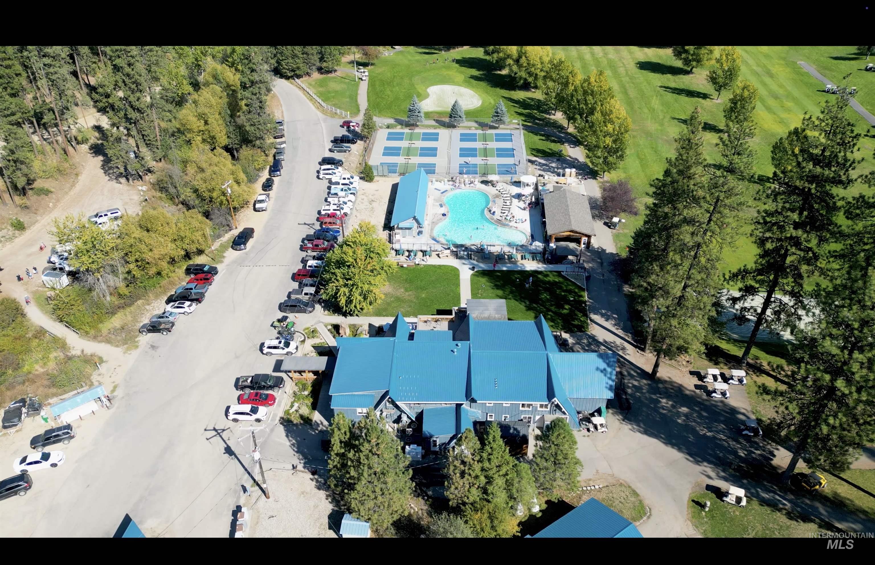 Aerial view of property's location featuring a pool area