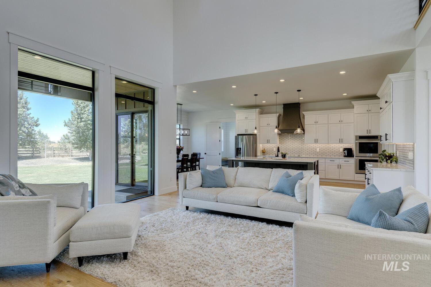 Living room featuring light wood-style floors and recessed lighting