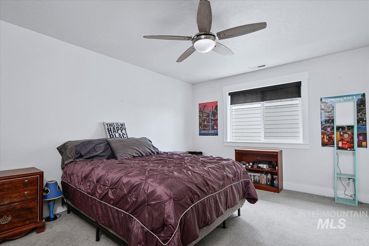 Neutral wall finishes with a ceiling fan light fixture