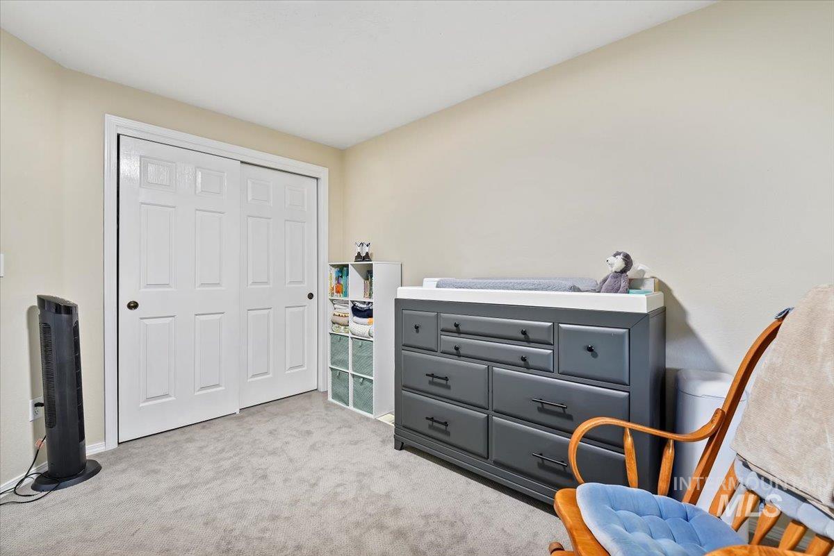 Living area with light colored carpet