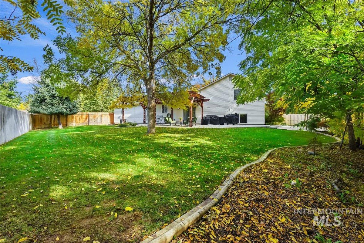Fenced backyard with a patio area